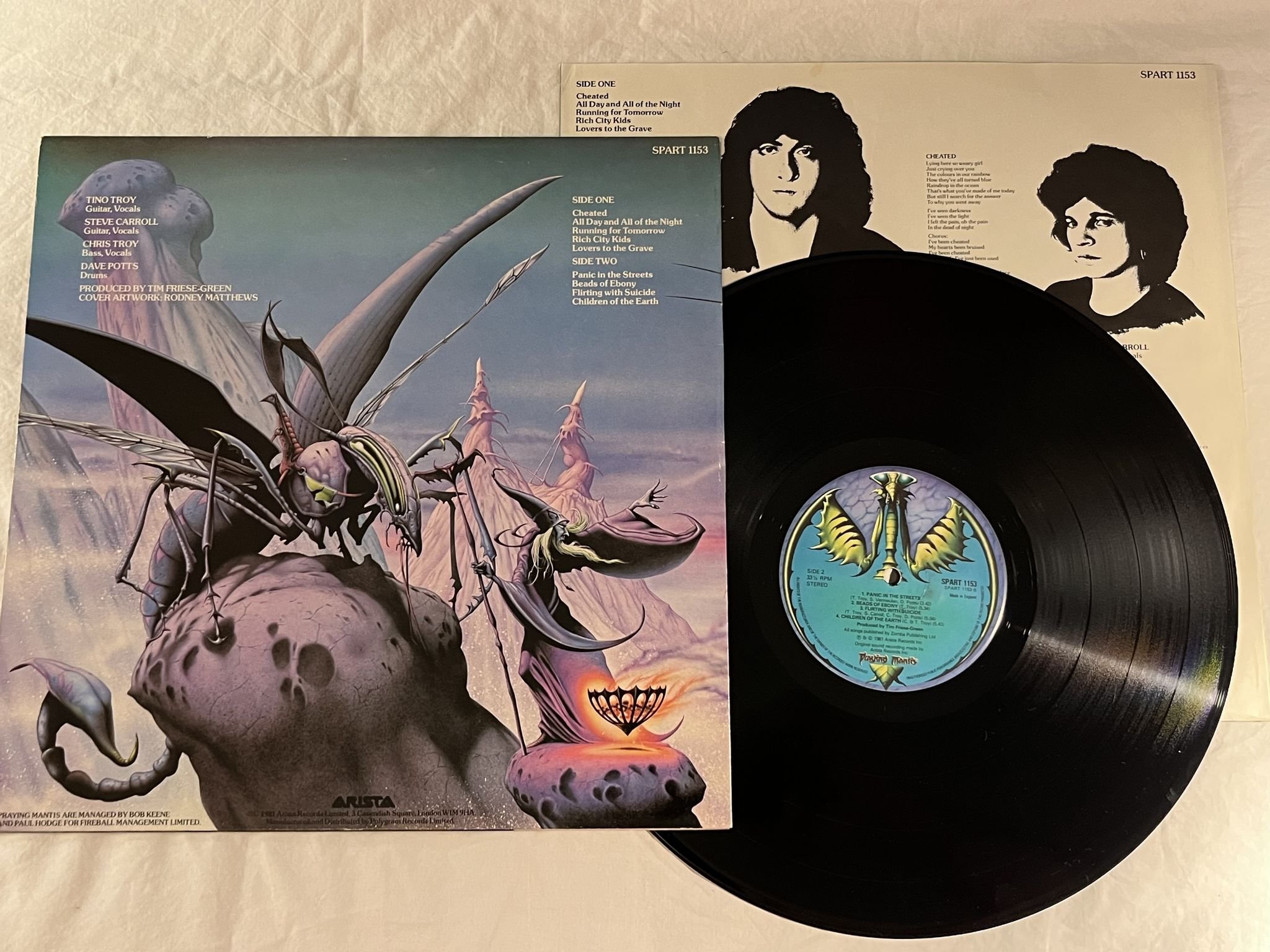 Omslagsbild för skivan PRAYING MANTIS time tells no lies LP -81 UK ARISTA SPART 1153