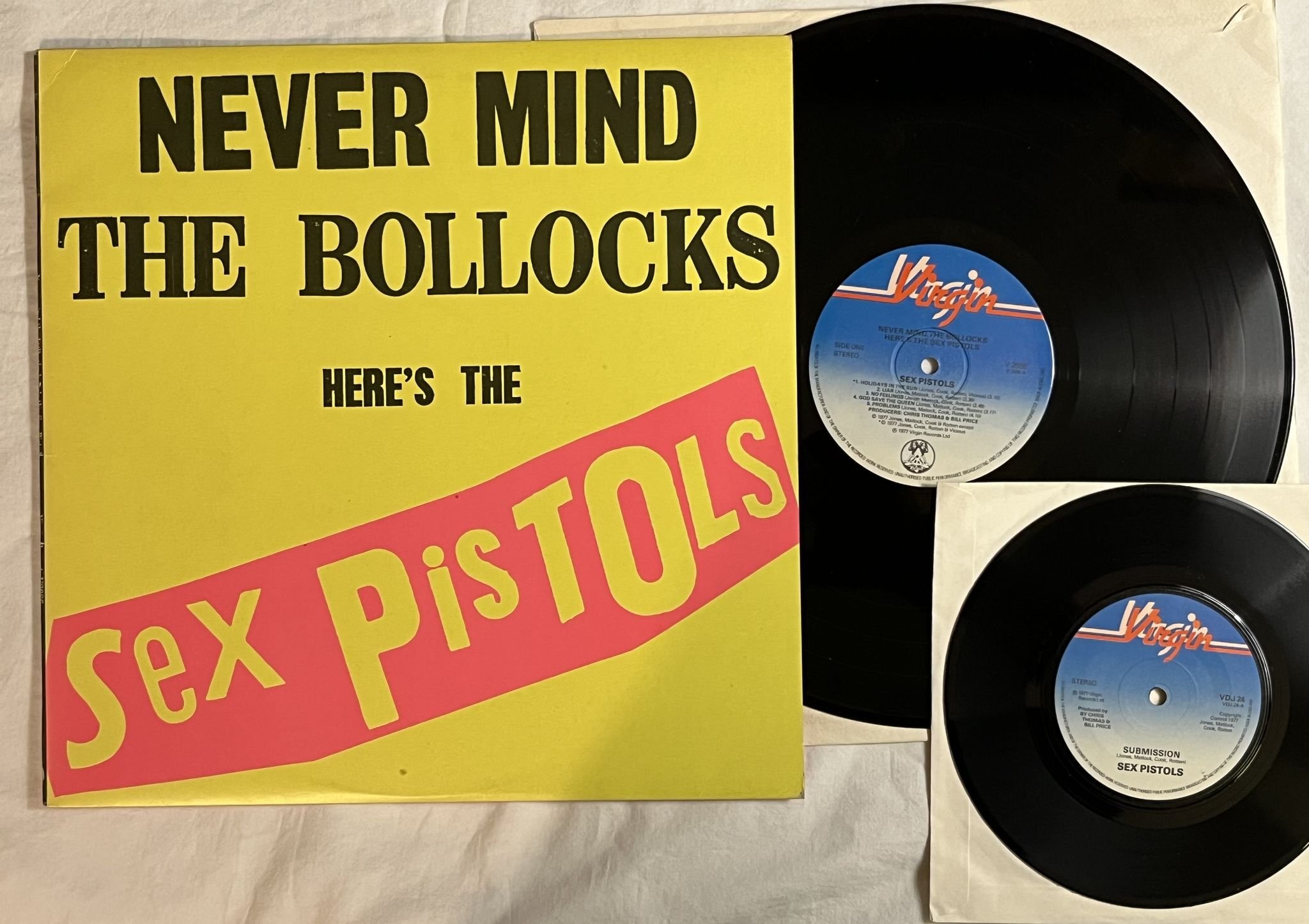 Omslagsbild för skivan SEX PISTOLS never mind the the bollocks LP + 45 * Mega rare 11 track + poster *