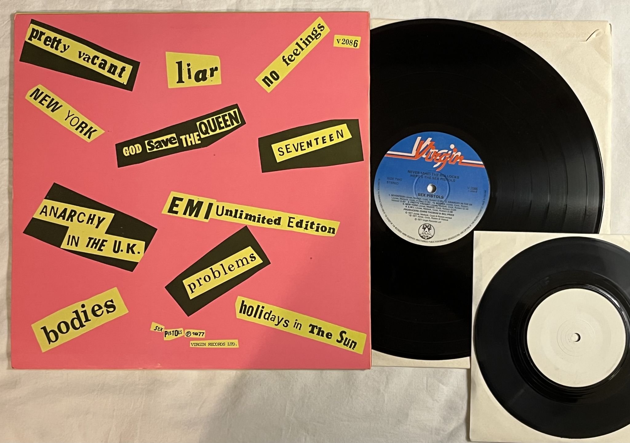 Omslagsbild för skivan SEX PISTOLS never mind the the bollocks LP + 45 * Mega rare 11 track + poster *