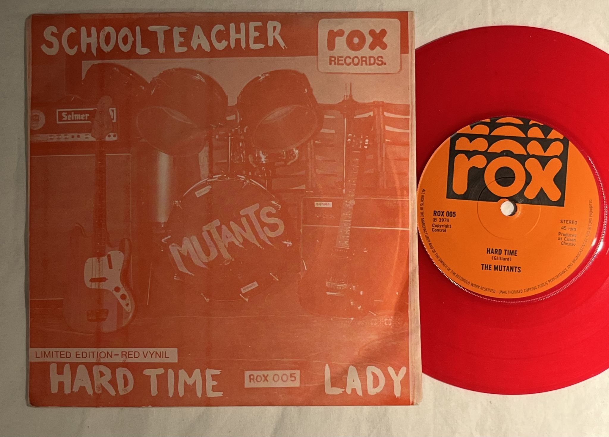 Omslagsbild för skivan MUTANTS schoolteacher 7" -78 UK ROX 005 *** Red Vinyl ***