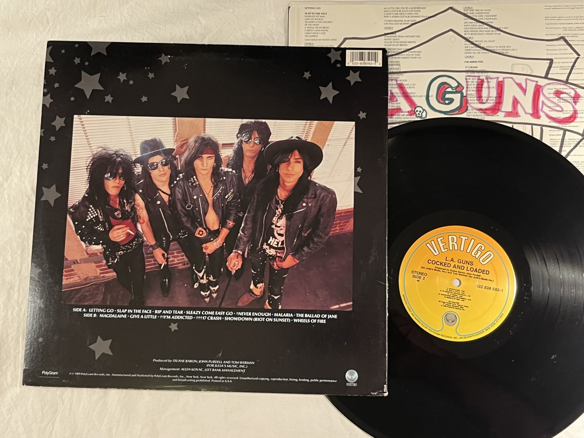 Omslagsbild för skivan LA GUNS Cocked & Loaded LP -89 US VERTIGO 838 592-1 *** Yeah ! ! ***