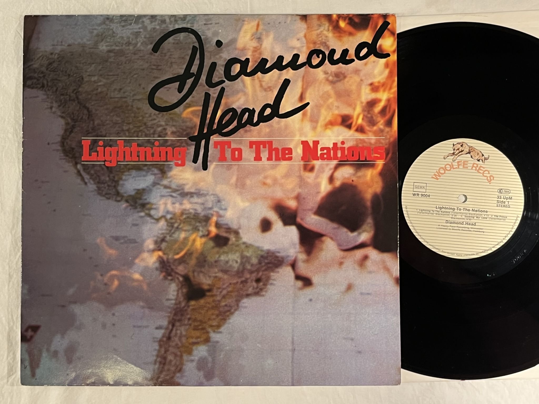 Omslagsbild för skivan DIAMOND HEAD Lightning To The Nations LP -81 Ger WOOLFE RECS WR 9004 ** RARE **